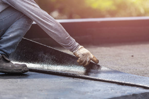 Professional Basement Waterproofing technician working in Triangle, VA